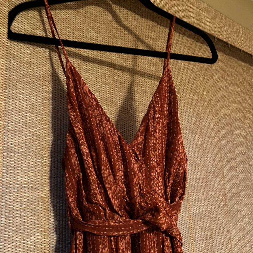 Sexy jumpsuit-beautiful color-top fully lined.  Flowy & comfortable 100% rayon.